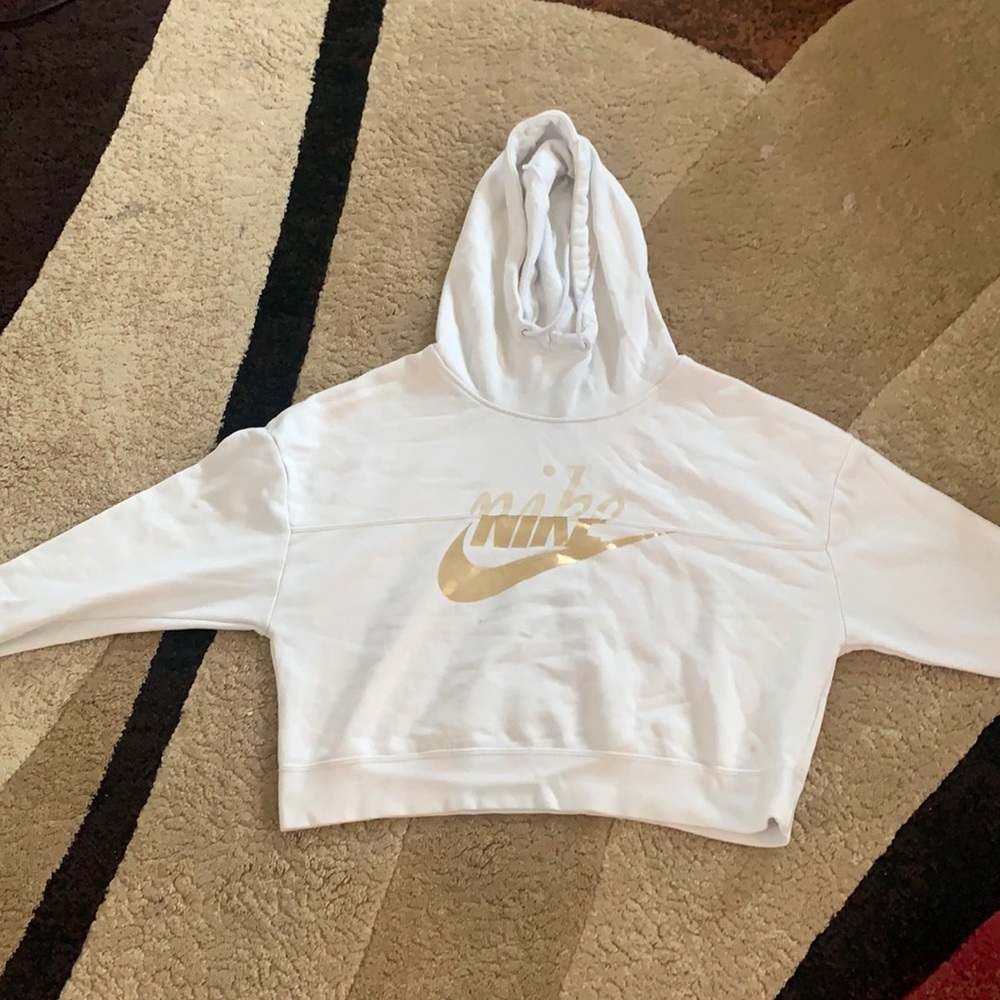 A small women’s white cropped Nike hoodie